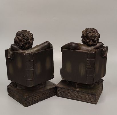A pair of composite bookends
with sleeping...