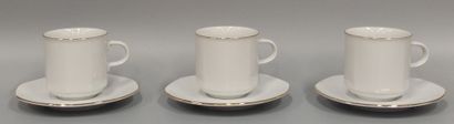 Six large coffee cups and saucers in white...