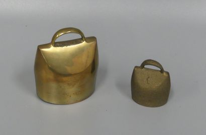 Lot: two small brass goat bells
the small...