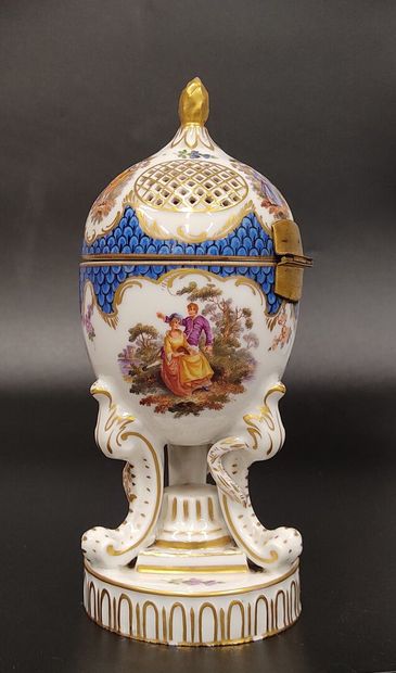 A Nyon porcelain potpourri egg decorated...