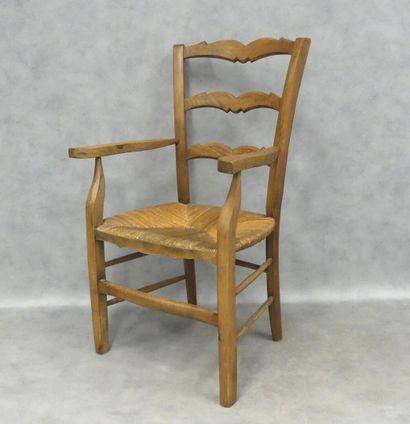 Wooden armchair, straw-covered seat, two...