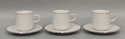 Six large coffee cups and saucers in white...
