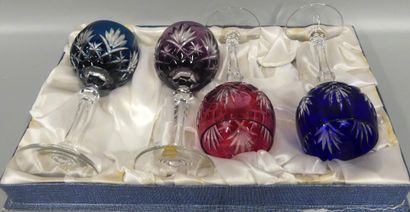 A set of four coloured cut-crystal glass...