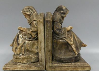 A pair of bookends in patinated plaster:...