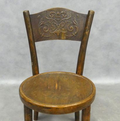 A small bistro-style children's chair in...
