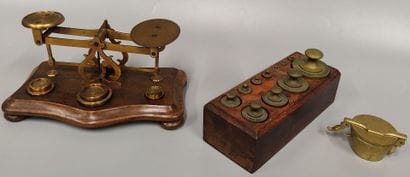 A brass set: 
A small changer scale with...