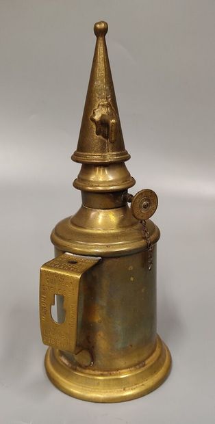 Two Pigeon lamps, one with its glass, the...