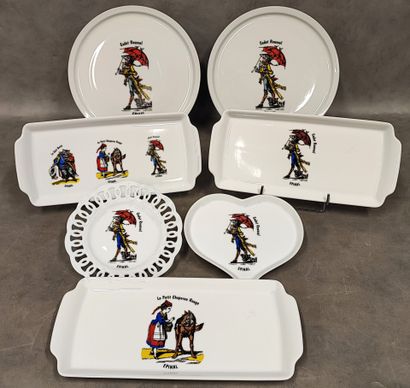 A set of seven white porcelain pieces decorated...