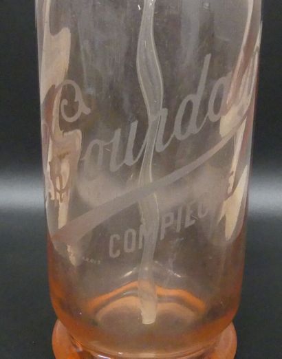 A pink glass bottle of seltzer
Ch .Gourdain...