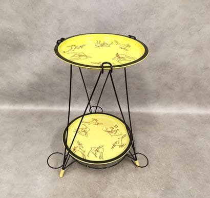 A small tripod sideboard with two trays in...
