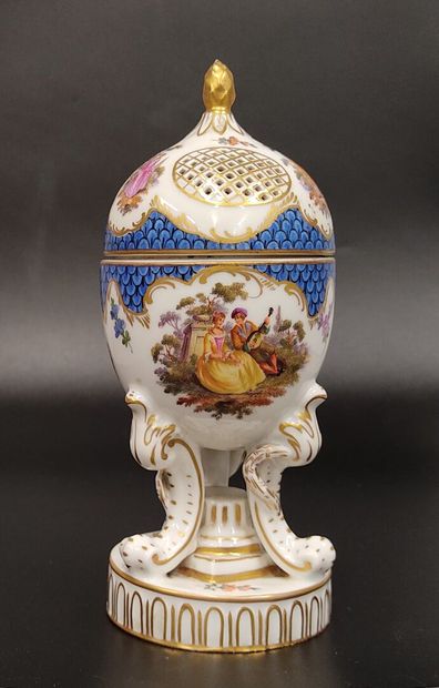 A Nyon porcelain potpourri egg decorated...