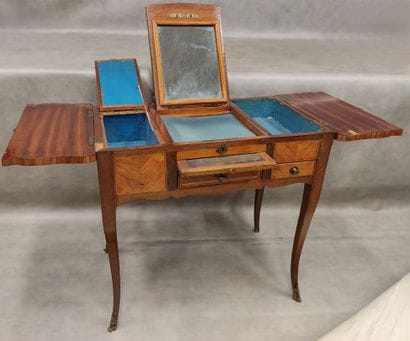 A small dressing table in marquetry with...