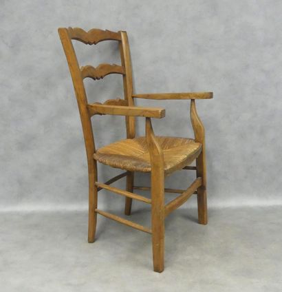 Wooden armchair, straw-covered seat, two...