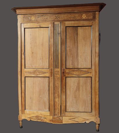 A two-door Transition-style cabinet decorated...