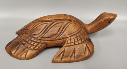 An awale game tray decorated with a ram's...