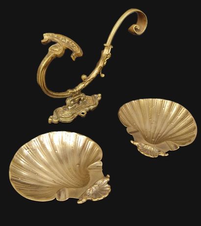A pair of shell-shaped brass ashtrays
One...