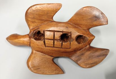 An awale game tray decorated with a ram's...