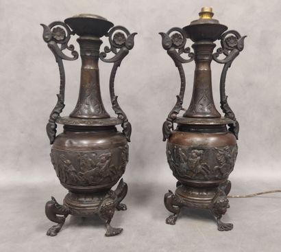 A pair of regula vases with handles, decorated...