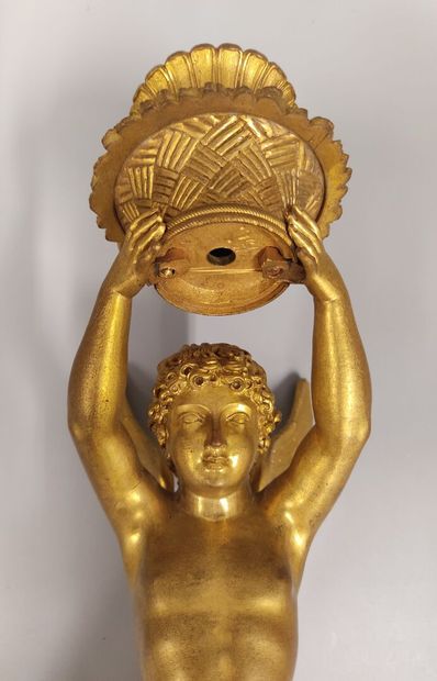 A pair of gilt bronze and chased sconces
depicting...