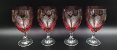 Set of four engraved pink-tinted crystal...