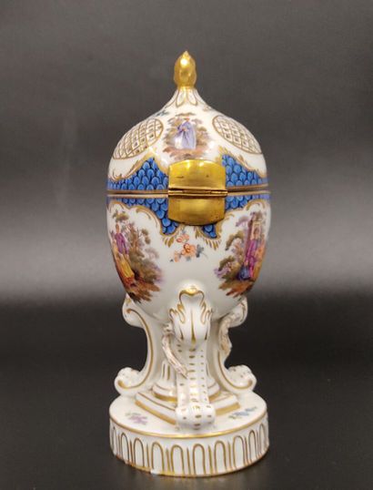 A Nyon porcelain potpourri egg decorated...