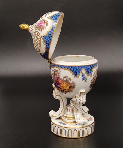 A Nyon porcelain potpourri egg decorated...