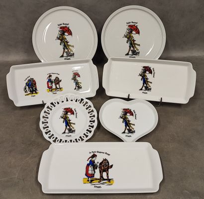 A set of seven white porcelain pieces decorated...