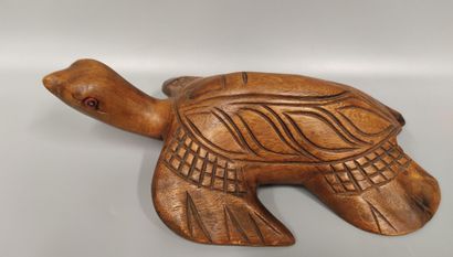 An awale game tray decorated with a ram's...