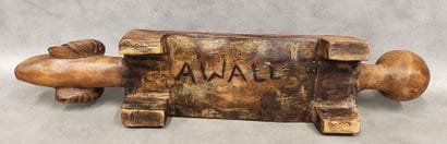An awale game tray decorated with a ram's...
