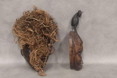 A set of 7 modern wooden masks including...