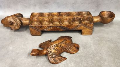 An awale game tray decorated with a ram's...