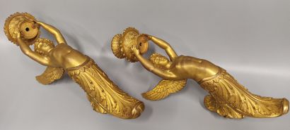 A pair of gilt bronze and chased sconces
depicting...