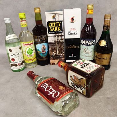 Set of nine bottles of spirits:
One bottle...