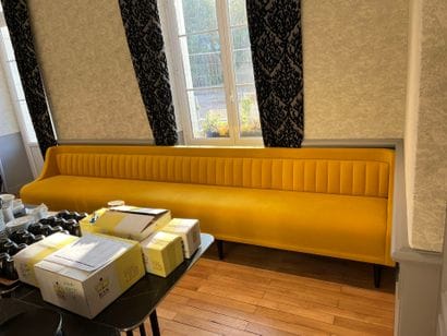 LARGE BANQUETTE in wood with yellow trim....
