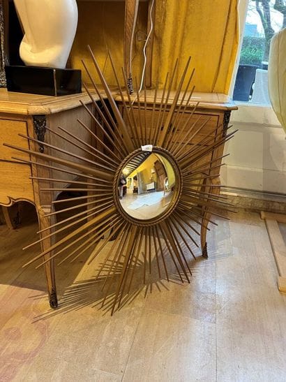 WITCH MIRROR Gilded metal frame with radiant...