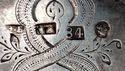 Flat silver case engraved with scrolls and...