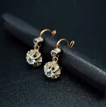 Pair of yellow gold (eagle) sleeper earrings,...