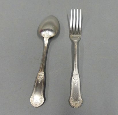 Twelve pieces of silver-plated flatware decorated...