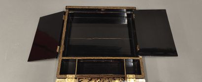 CHINA, 20th century
Black and gold lacquer...