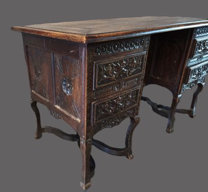 A mazarin desk in natural wood in the Henri...