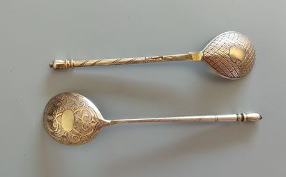 Two small vermeil spoons with different decorations,...