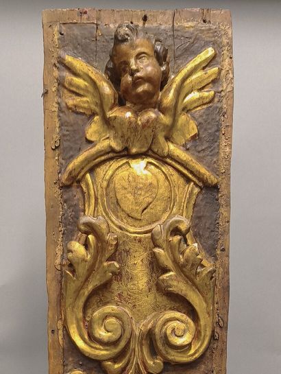 Gilded wood panel carved with a cherub, 17th...