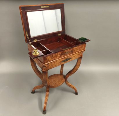 Small burr veneered book table from the Charles...