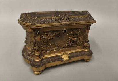 Gilt bronze and patinated jewelry box decorated...