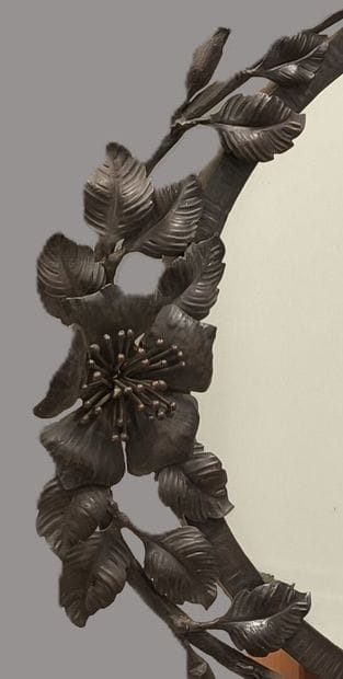 Oval hammered wrought-iron mirror with rosehip...