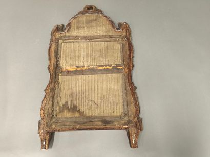 Louis XVI period carved and gilded wood mirror...