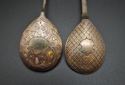 Two small vermeil spoons with different decorations,...