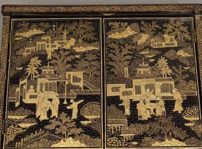 CHINA, 20th century
Black and gold lacquer...