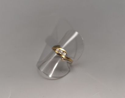 Two-tone gold ring set with three small white...