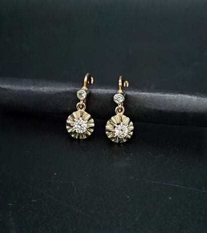 Pair of yellow gold (eagle) sleeper earrings,...